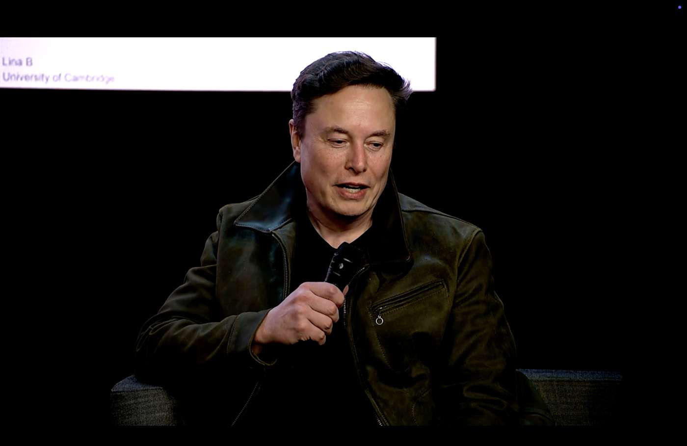 Tech Conference Speaker in Dark Setting