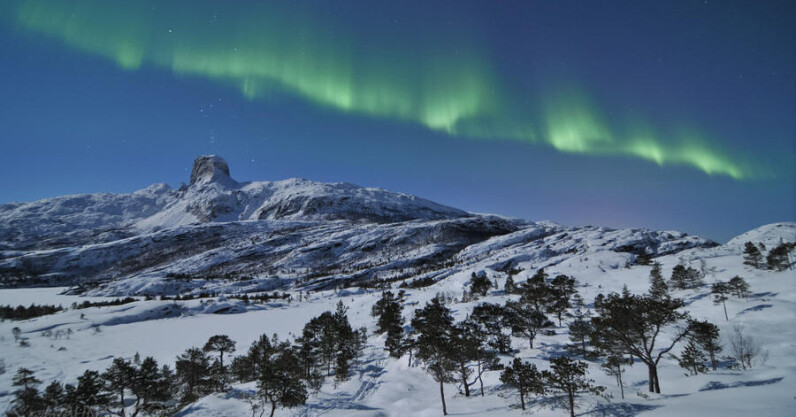 Northern Lights Over Arctic Mountain Landscape