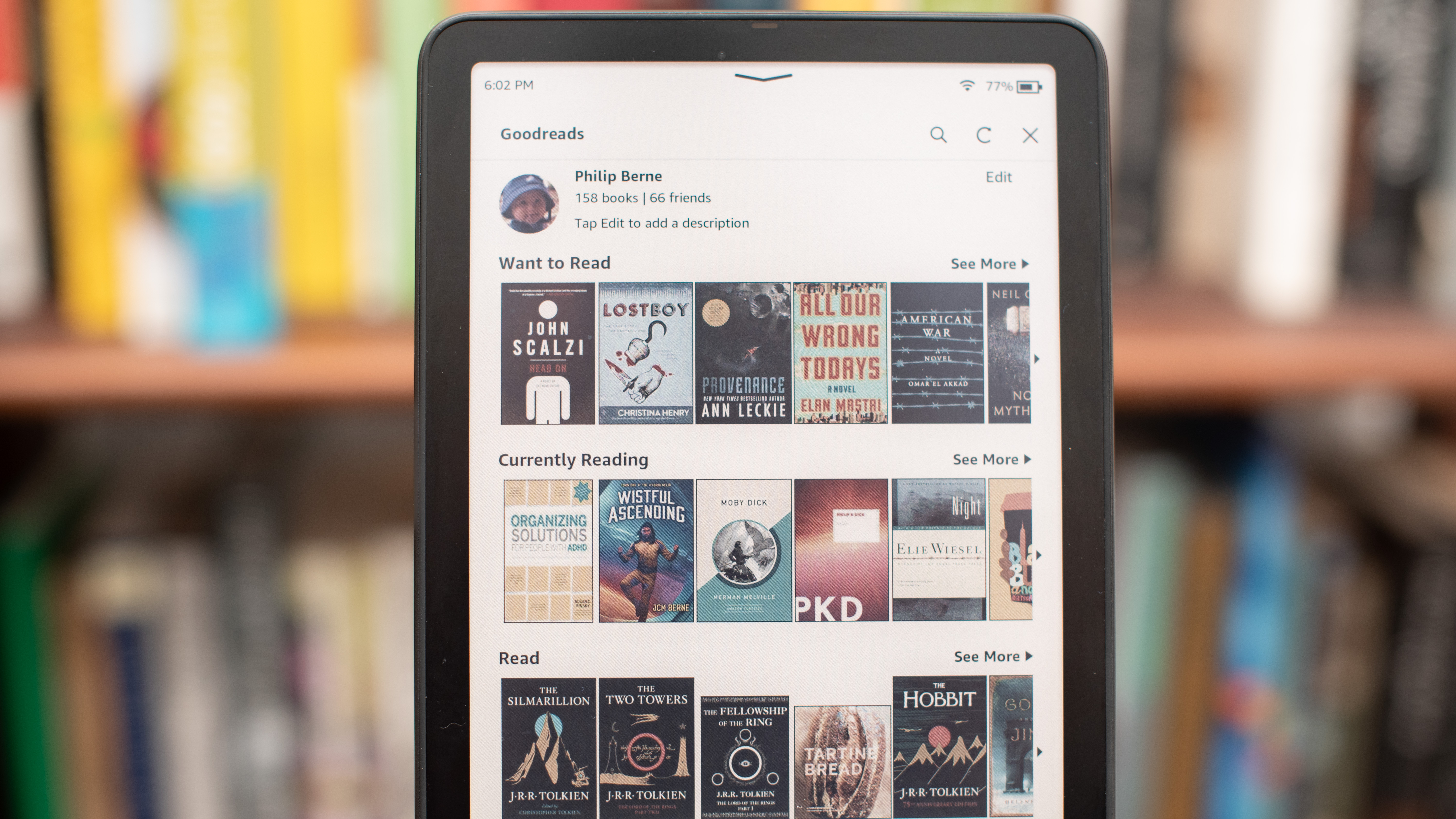 Amazon Kindle Colorsoft Signature edition e-reader showing graphic novels, cookbooks, and fiction, as well as settings