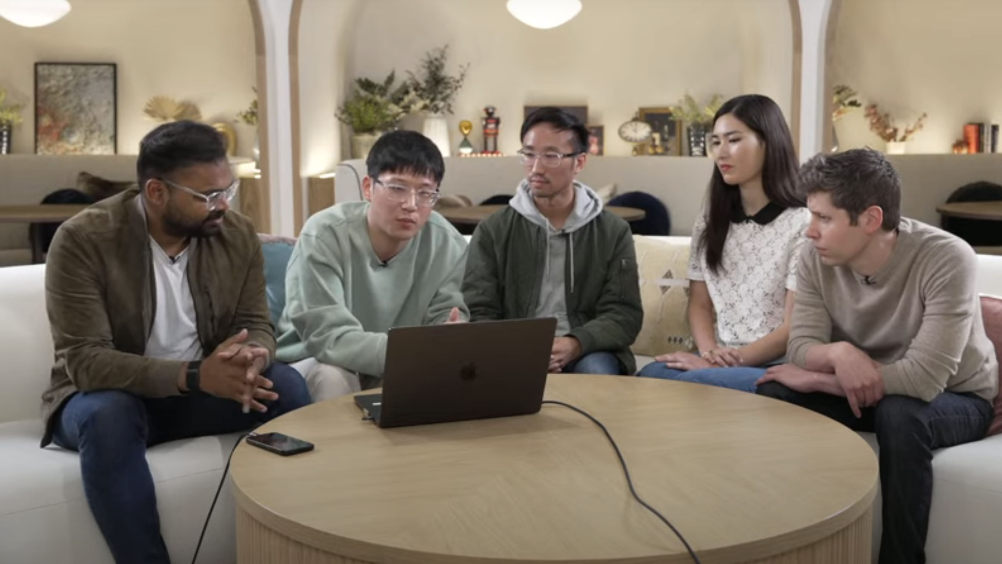 OpenAI team sat around a table
