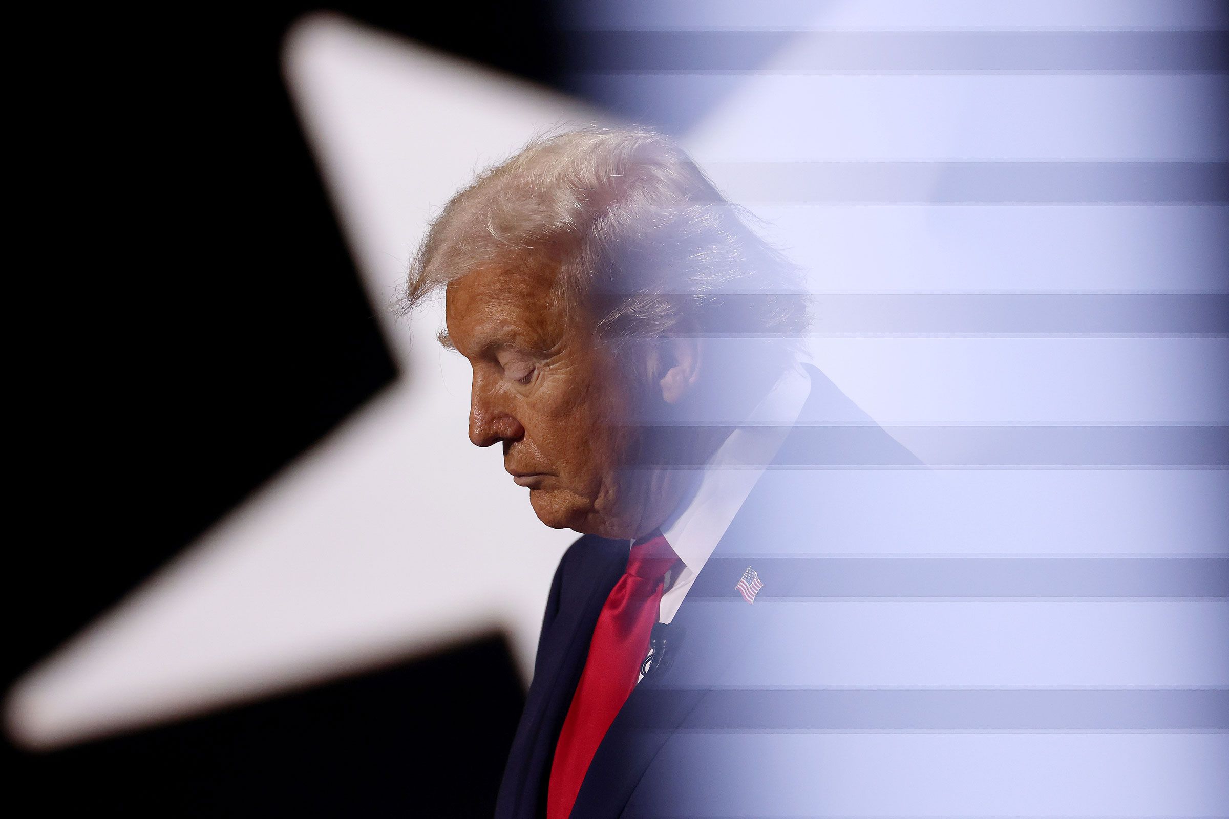 Image may contain Donald Trump Face Head Person Photography Portrait People Adult Accessories Formal Wear and Tie